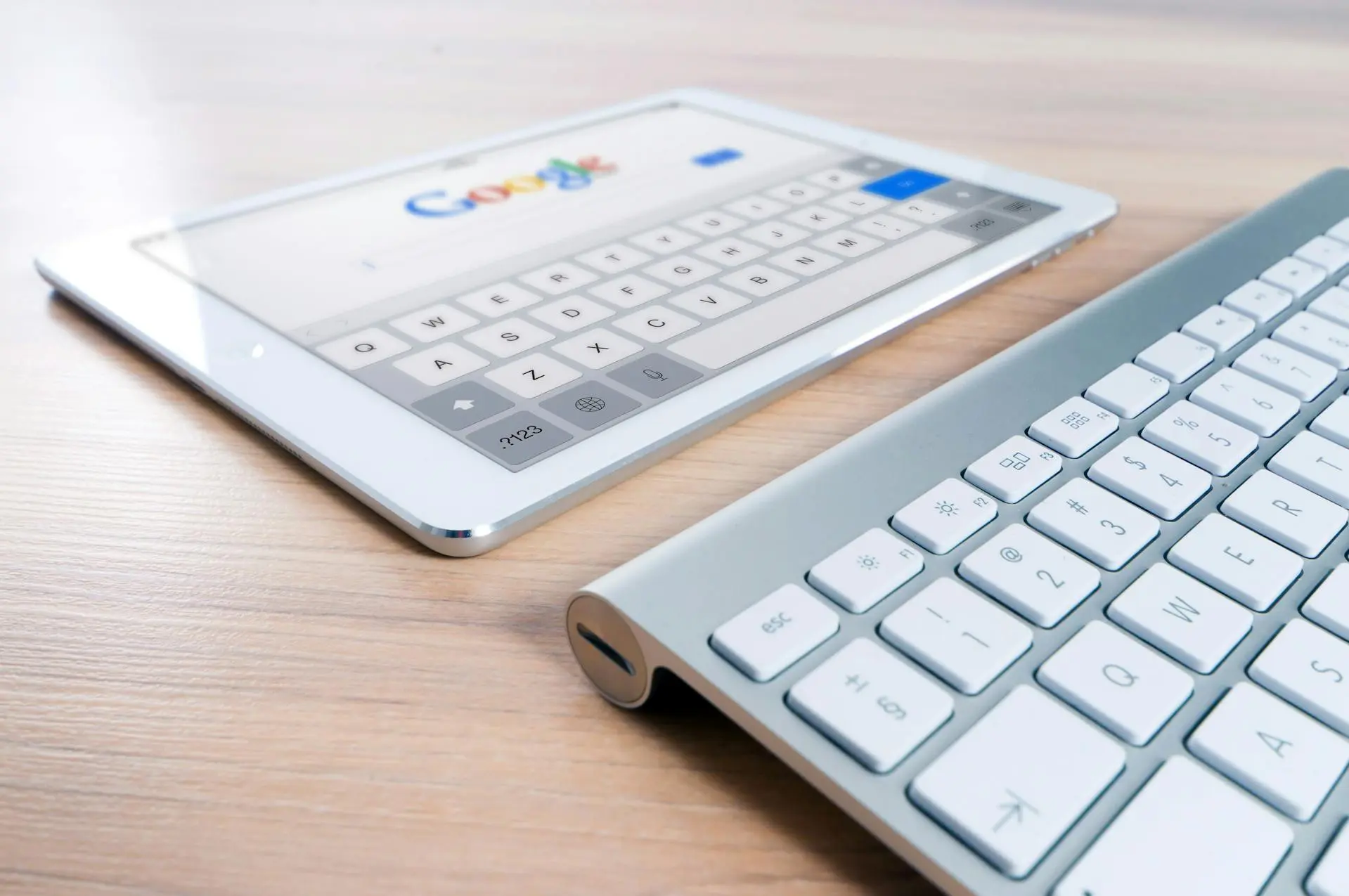 Tablet with Google search and computer keyboard