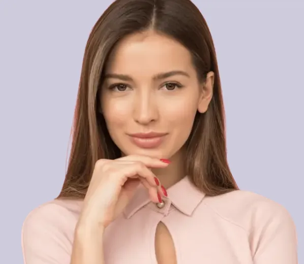 Smiling woman with long brown hair posing confidently